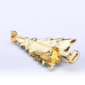 Detail view of the Christmas tree brooch back with a gold metallic brushed texture
