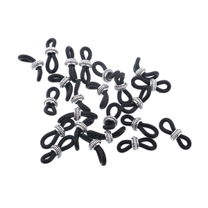 Close-up of black silicone anti-slip loops with silver metal rings for DIY eyewear chains