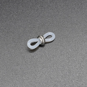 Detail of clear silicone anti-slip loops with silver engraved metal rings for eyewear chains