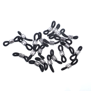 Detail of black silicone loops with silver engraved metal beads for DIY eyewear chains