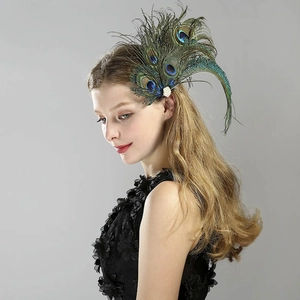 Detail of peacock feather hair clip with white pearls and rhinestones on hair