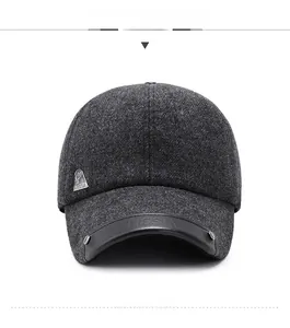Detailed view of winter wool baseball cap with leather visor and metallic logo side accent