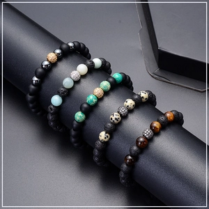 Detail of 8mm lava rock and tiger eye stone bracelets with micro-pave zircon balls