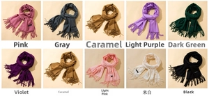 Grid display of cashmere-feel tassel scarves in multiple solid colors like pink and grey