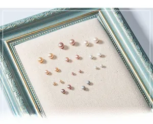 Detailed display of natural freshwater pearls in varied colors and sizes for silver studs