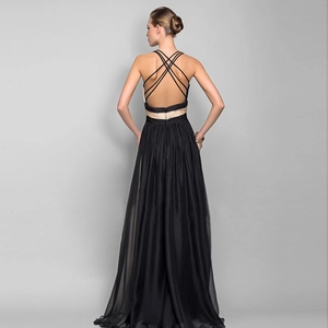 Elegant backless black floor-length evening gown with criss-cross straps and gold waist detail