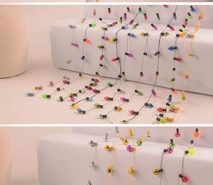 Close-up of colorful mini plastic Christmas bulb strings and round bead ornaments