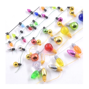 Colorful mini Christmas bulb ornaments in mixed plating colors on a white background