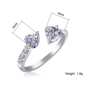 Detail of silver heart ring with 5mm and 6mm zircon stones and 1.8g weight specs