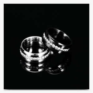 Macro view of 8mm brushed stainless steel rings with full crystal stone inlay