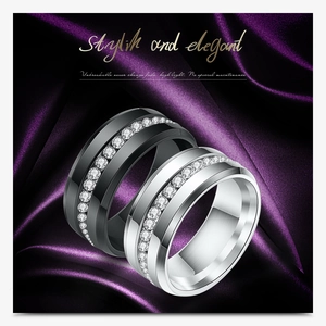 Detail of couple rings in black and silver steel with micro-pave cubic zirconia inlay