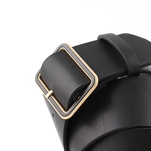 Women's minimalist wide black leather waist belt with polished square gold metal buckle