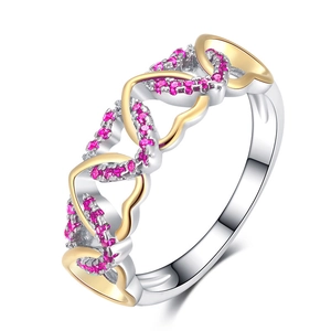 Two-tone intertwined heart ring with pink zircon pavé setting on white background