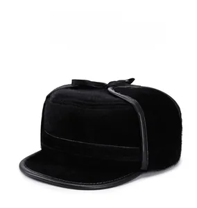 Detailed close-up of a black faux fur winter hat with soft plush texture and wide brim