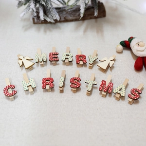 Set of Christmas wooden clips with Merry Christmas letters and angel shapes for decoration