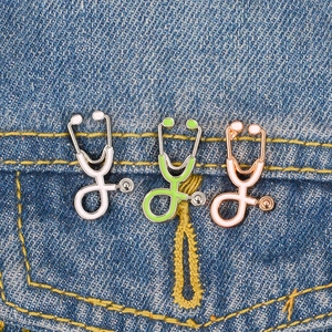Retro metal stethoscope enamel brooches in three colors pinned on denim pocket