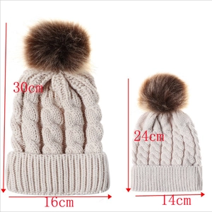 Size chart for chunky cable knit parent-child beanies with faux fur pom poms