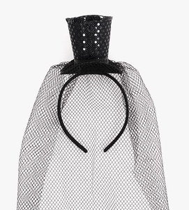 Detail of a black sequined mini top hat headband with large mesh veil for parties