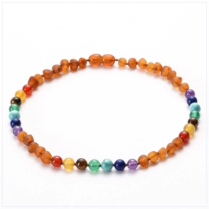 Macro view of multi-color beads with amber and natural stones in circular arrangement