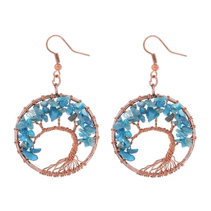 Detailed craftsmanship of bronze wire tree of life earrings with blue natural crystal