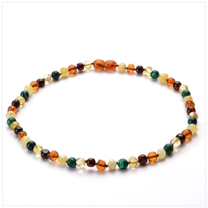 Detail of amber baby necklace with turquoise beads and secure screw clasp closure
