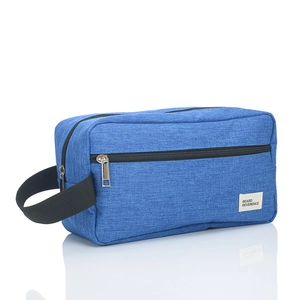 Blue fabric toiletry bag with black handle and beard reverence tag on white background