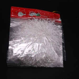 White snowflake Christmas hanging ornaments in retail packaging with festive red header card