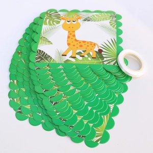 Detail of paper party banner featuring green giraffe and palm leaf tropical cards