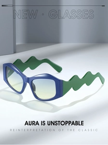 Detail of unique green wavy temples and gradient lenses on irregular cat-eye sunglasses