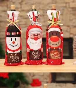 Detailed view of Christmas wine bottle covers with Santa, Snowman and Reindeer patterns