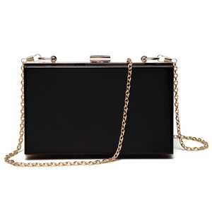 Elegant black acrylic clutch bag with a high-gloss finish and golden chain strap