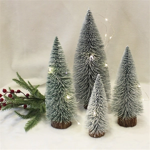 Mini snow-flocked Christmas tree set with warm LED lights and wooden base decor