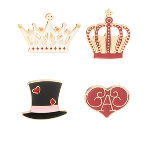 Set of four vintage enamel pins featuring a crown, top hat, and red heart on white background