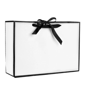 Minimalist white gift paper bag with black ribbon bow and elegant border design