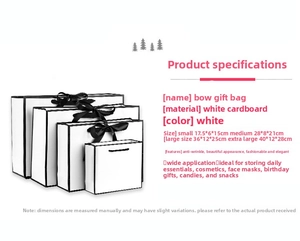 Detailed size chart for white paper gift bags with black bow and decorative trim