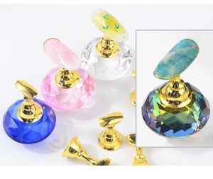 Detailed close-up of colorful crystal magnetic nail art display stand with golden holders
