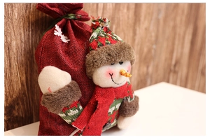 Detail of Christmas burlap gift bag with 3D snowman applique and festive drawstring closure