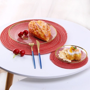 Macro detail of red woven placemats on dining table with gourmet desserts and pastry