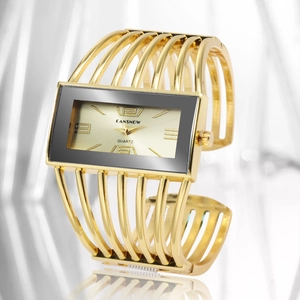 Elegant CANSNOW gold cuff watch for women with hollow mesh band and quartz movement