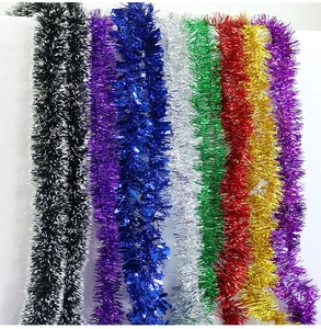 Close-up of vibrant tinsel garlands in multiple metallic colors for Christmas tree decor