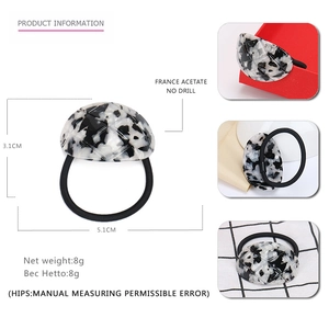 Black and white marble acetate curved hair tie product dimensions and detail views