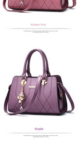 Detail of lychee pattern leather tote bags with V-shaped stitching and flower pendants