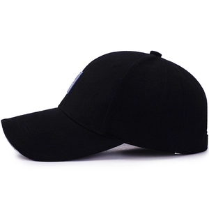Classic black cotton baseball cap with a blue square patch in a profile side view