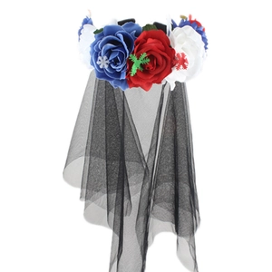 Macro detail of red, white and blue rose headband with black veil for festivals