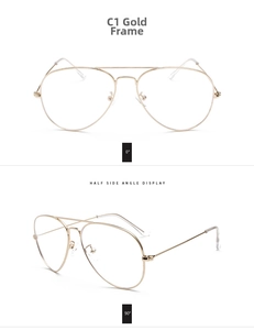 Detail view of gold aviator glasses frames with double bridge and clear lenses