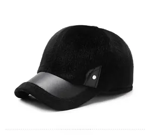 Detail of black faux fur winter baseball cap with matte leather brim and metal rivet