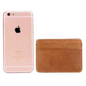 Vintage brown leather wallet slim card holder shown next to phone for size reference