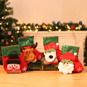 Close-up of four Christmas stockings with 3D snowman, reindeer, bear, and Santa appliques