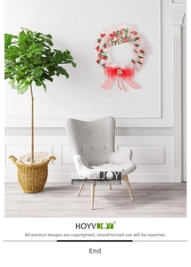 White Christmas wreath with red bows and Santa Claus doll on elegant home wall