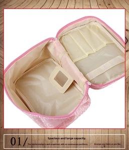 Pink cosmetic bag with built-in mirror, brush slots and large interior storage space